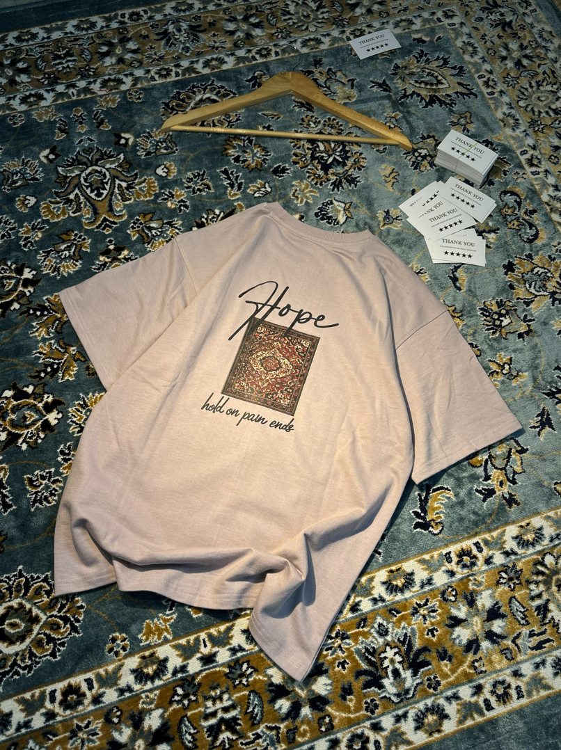 Hope Hold On Pain Ends Oversized Tee – flat lay on rug